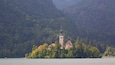 Church of Sv Marika Bozja featuring forests, a lake or waterhole and mountains