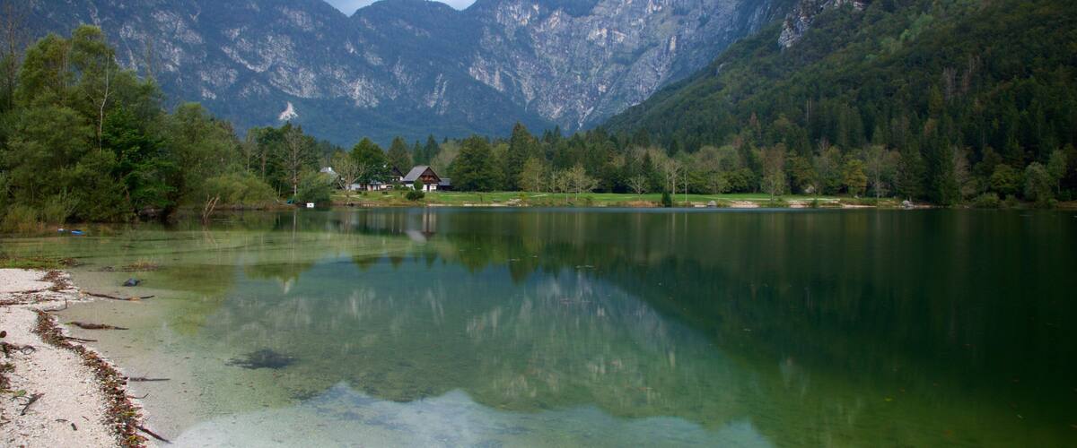 Lake Bohinj featuring a lake or waterhole and mountains