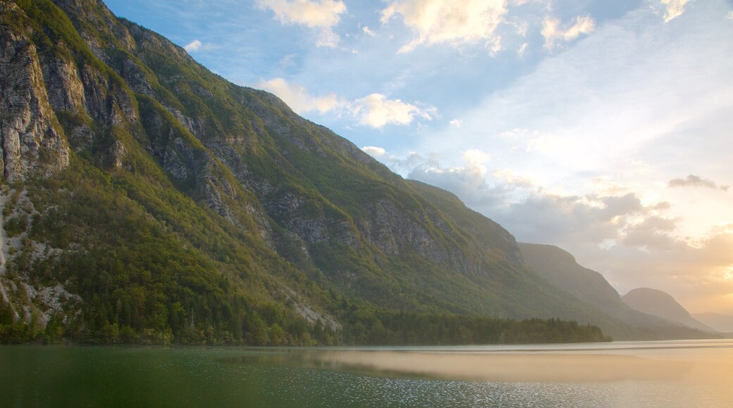 Lake Bohinj showing mountains, a sunset and a lake or waterhole