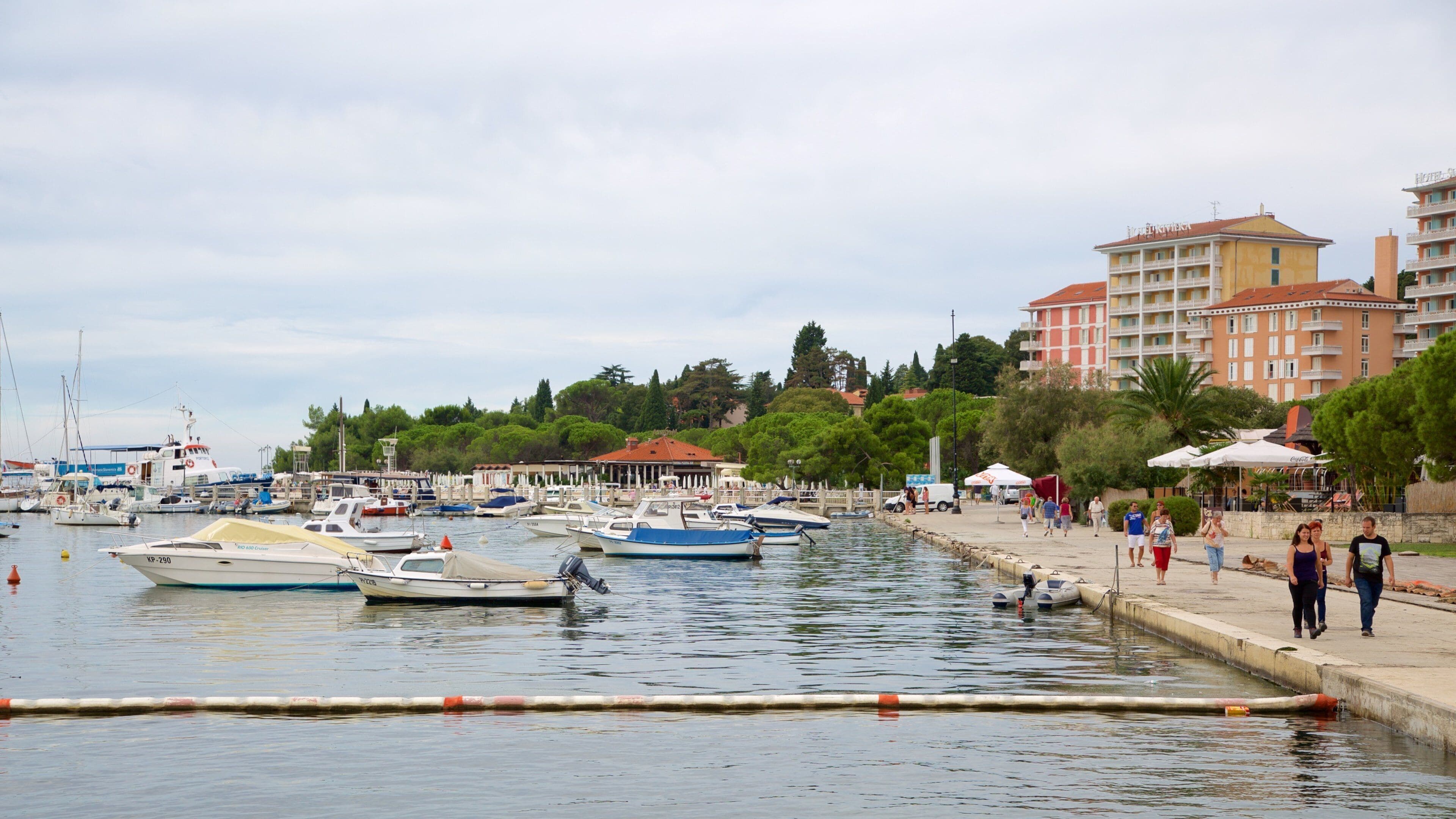 Portoroz Beach showing a coastal town, boating and a marina
