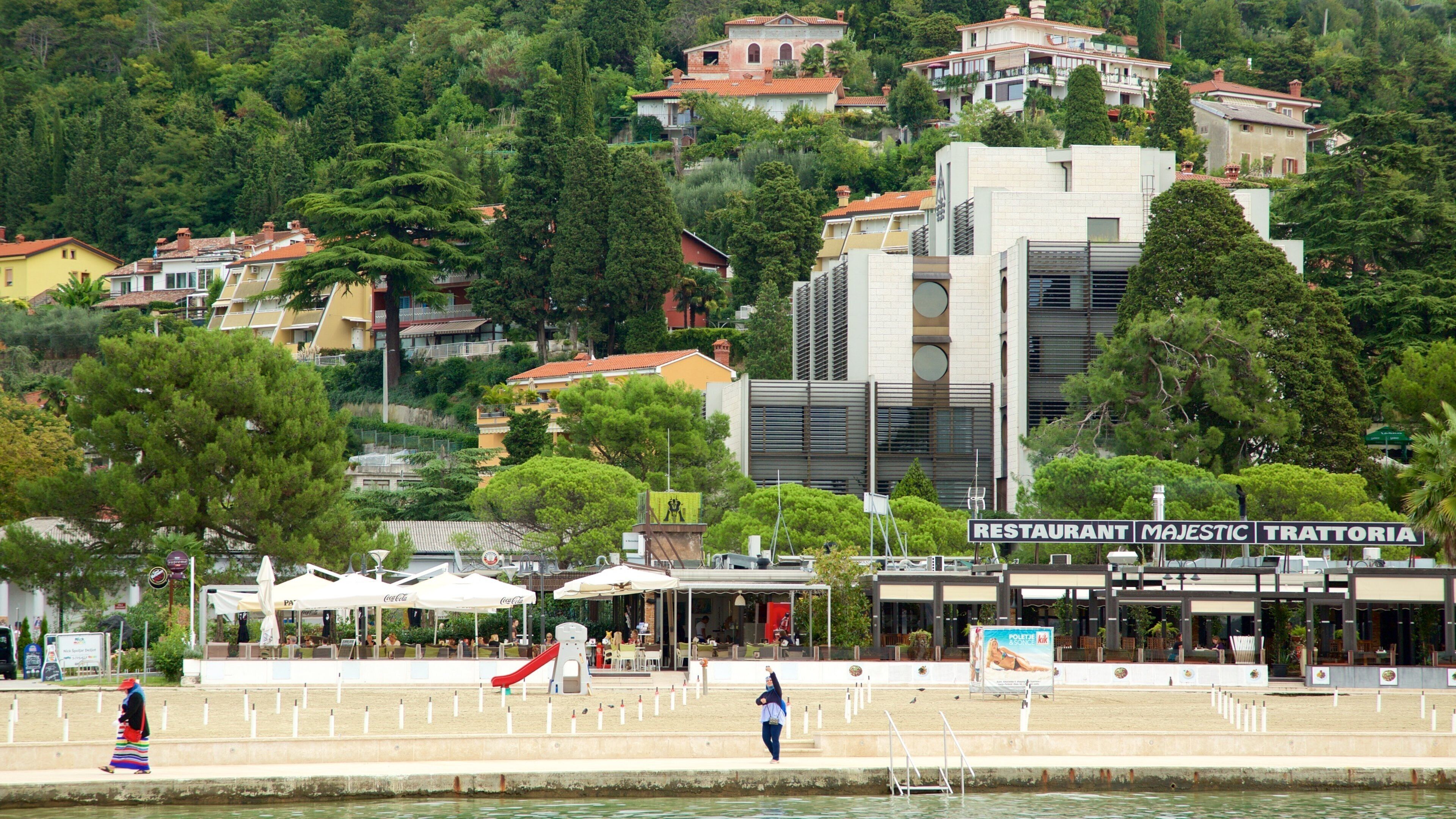 Portoroz Beach which includes outdoor eating and a coastal town