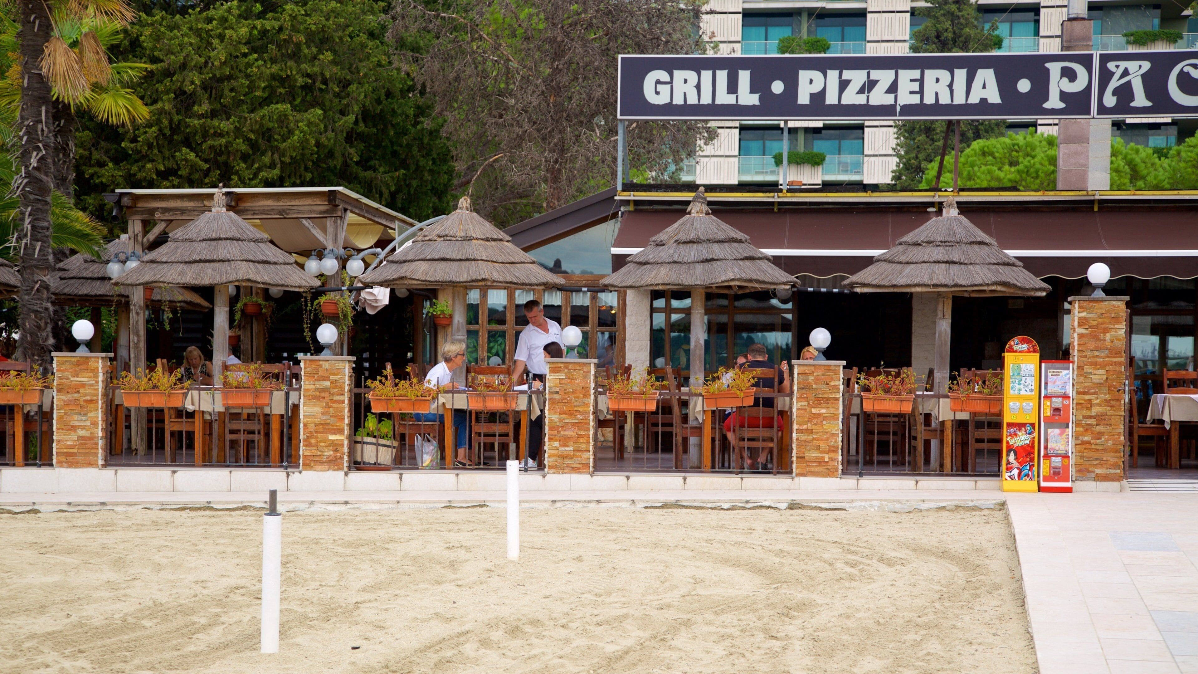 Portoroz Beach featuring a coastal town and outdoor eating