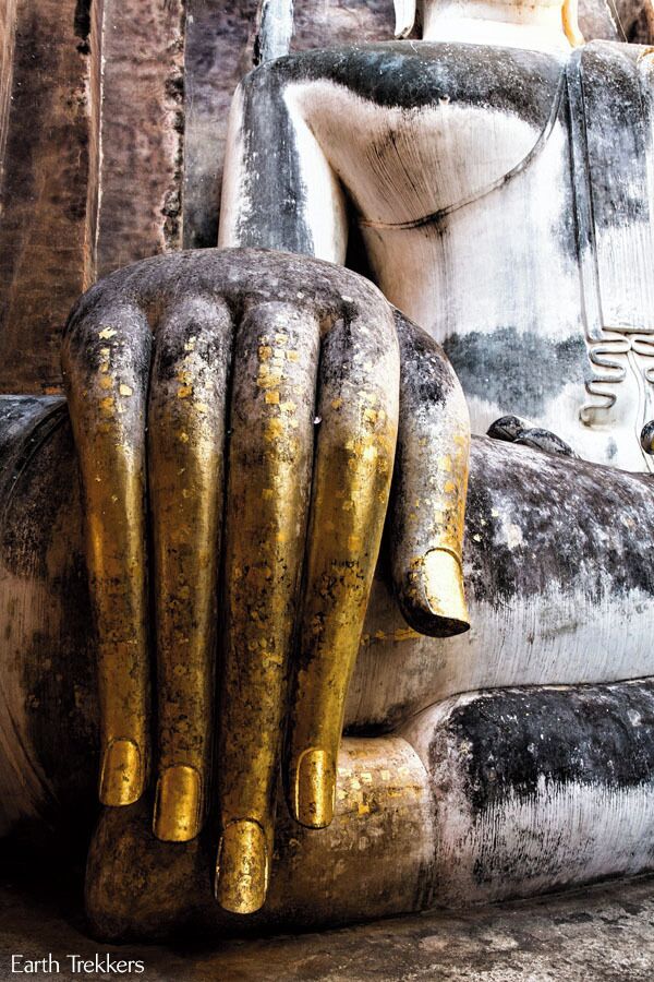 One of the highlights of visiting Sukhothai, Thailand is seeing the giant sitting Buddha at Wat Si Chum. You might not be able to tell from this photo, but this hand is so much taller than we are.

See more from Sukhothai: http://www.earthtrekkers.com/ayutthaya-and-sukhothai-ancient-cities-of-siam/