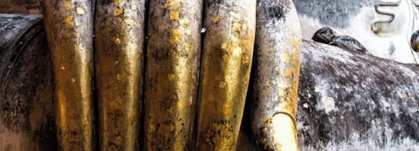 One of the highlights of visiting Sukhothai, Thailand is seeing the giant sitting Buddha at Wat Si Chum. You might not be able to tell from this photo, but this hand is so much taller than we are.
See more from Sukhothai: http://www.earthtrekkers.com/ayutthaya-and-sukhothai-ancient-cities-of-siam/