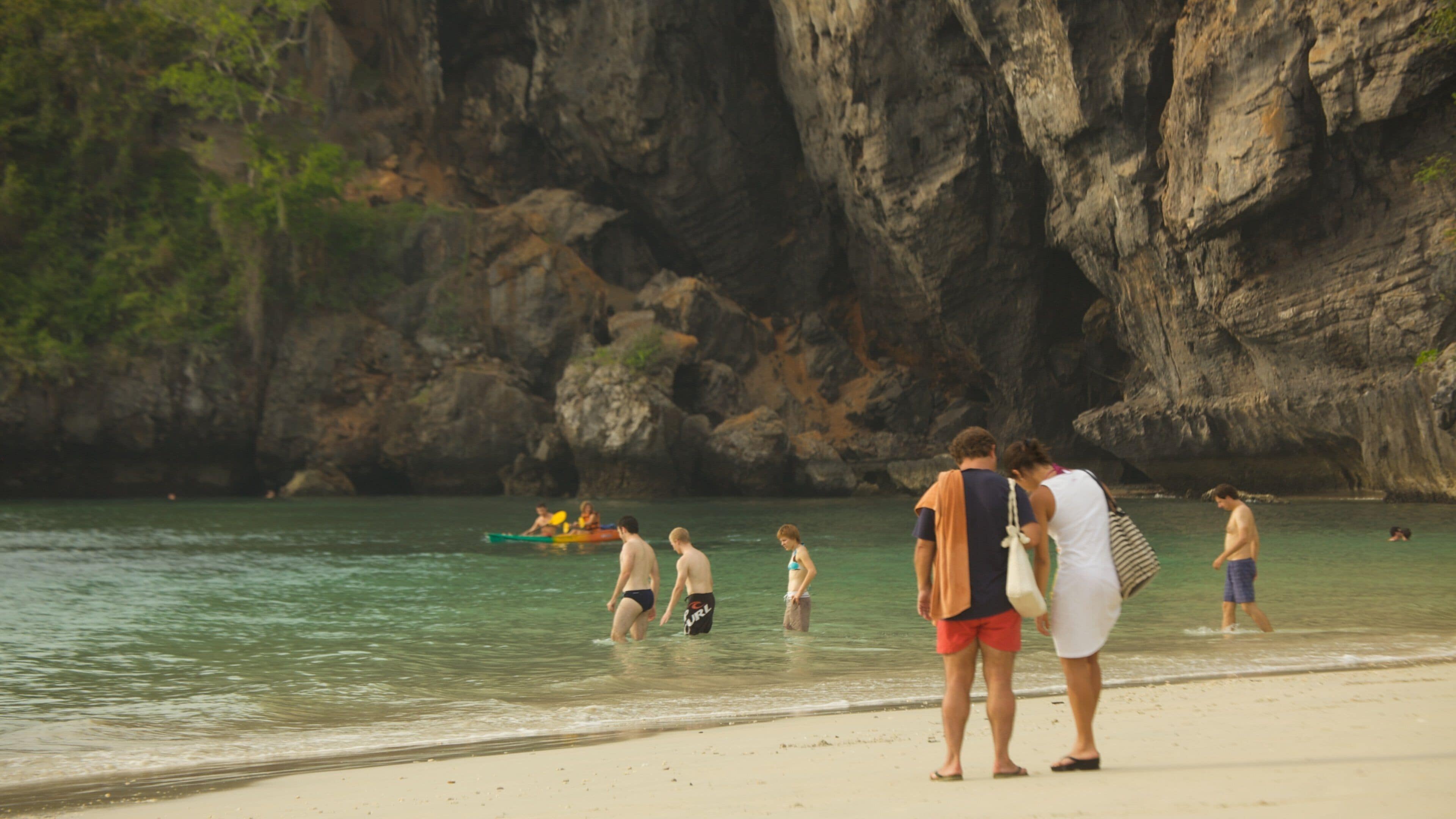 West Railay Beach which includes rocky coastline, swimming and a beach