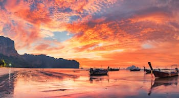 Traditional thai boats at sunset beach. Ao Nang Krabi province