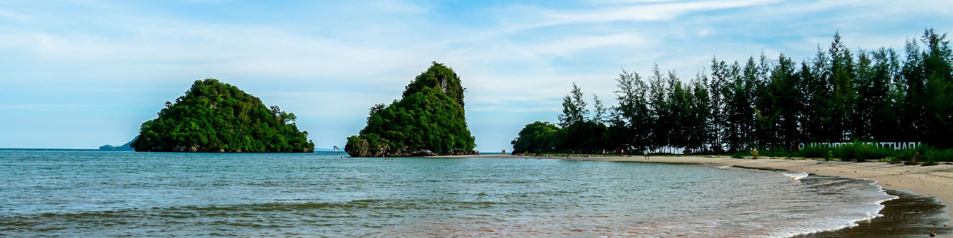 Blue sky and sea with tourist boat at Ao Nang or Nopparat Thara Beach, a destination of tourist in Krabi, Southern of Thailand