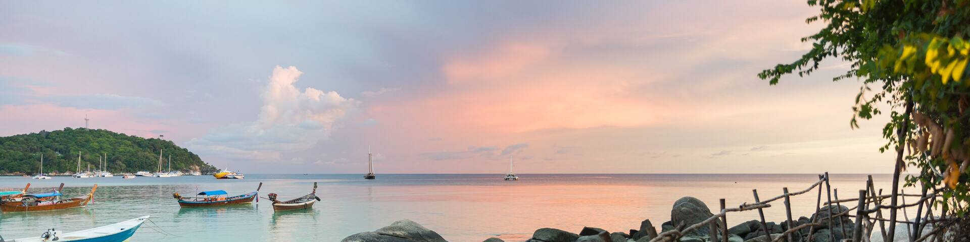 Wood bridge with sunset at pattaya beach in Koh Lipe Island