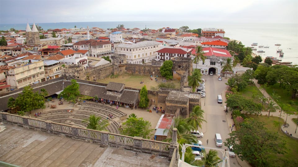A coastal town with historic buildings, a large open square, and a theater.