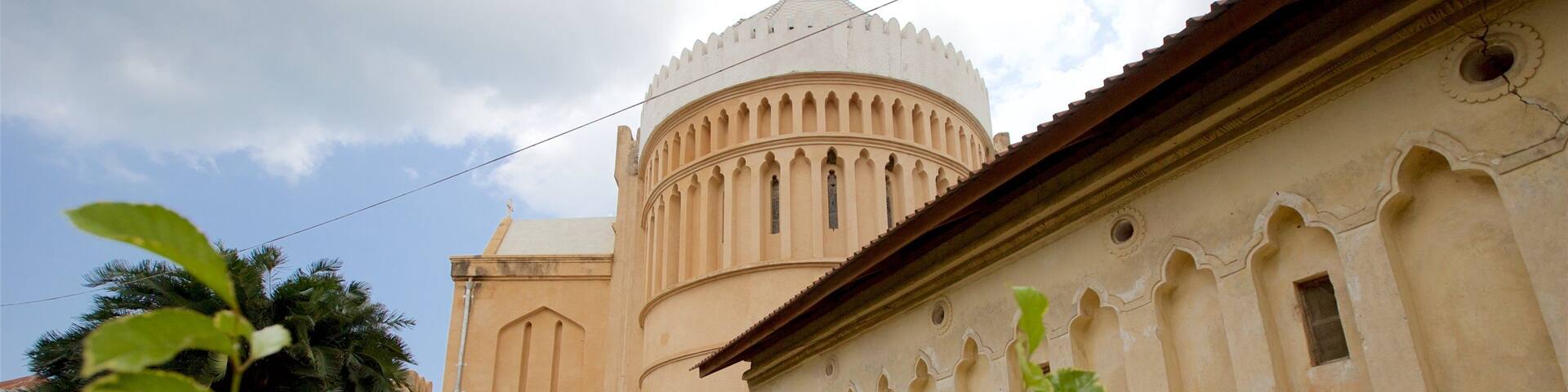 A historic building with a dome and arched windows.