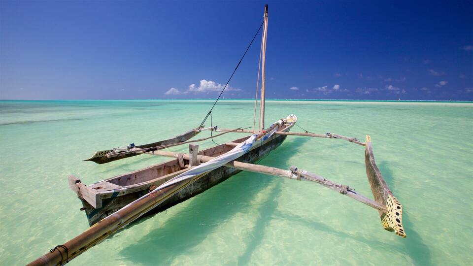 A traditional wooden boat on clear turquoise water.