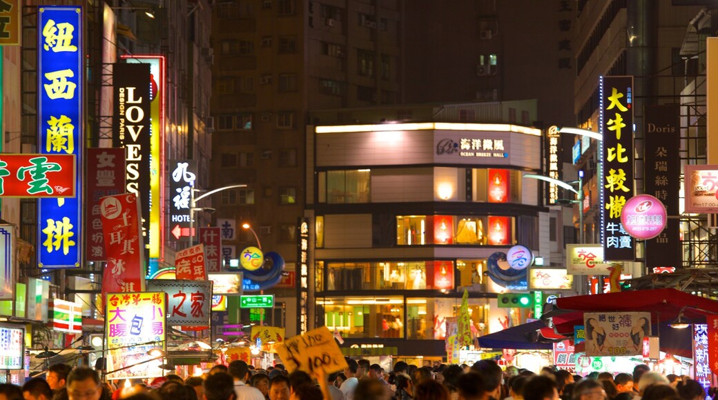 Liuhe Night Market which includes night scenes, markets and a city
