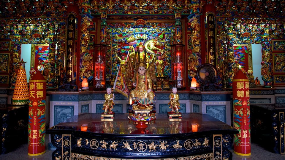 A richly decorated altar with golden statues and intricate carvings.
