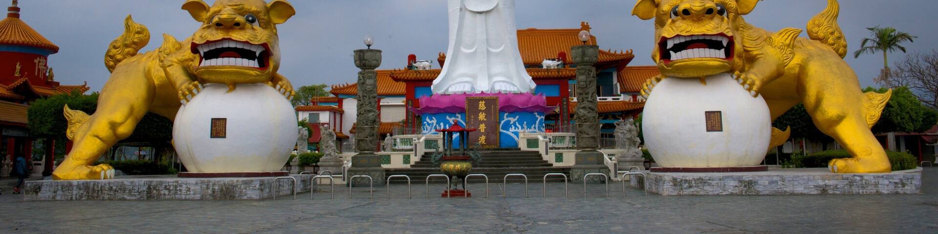 Statue of Guanyin showing a temple or place of worship, a statue or sculpture and religious elements