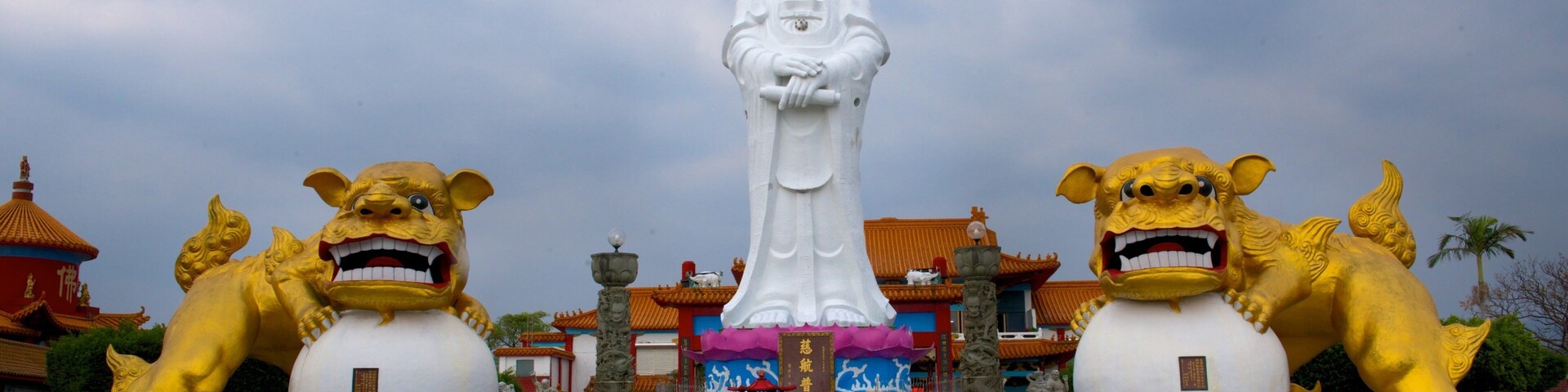 Statue of Guanyin showing a temple or place of worship, a statue or sculpture and religious elements