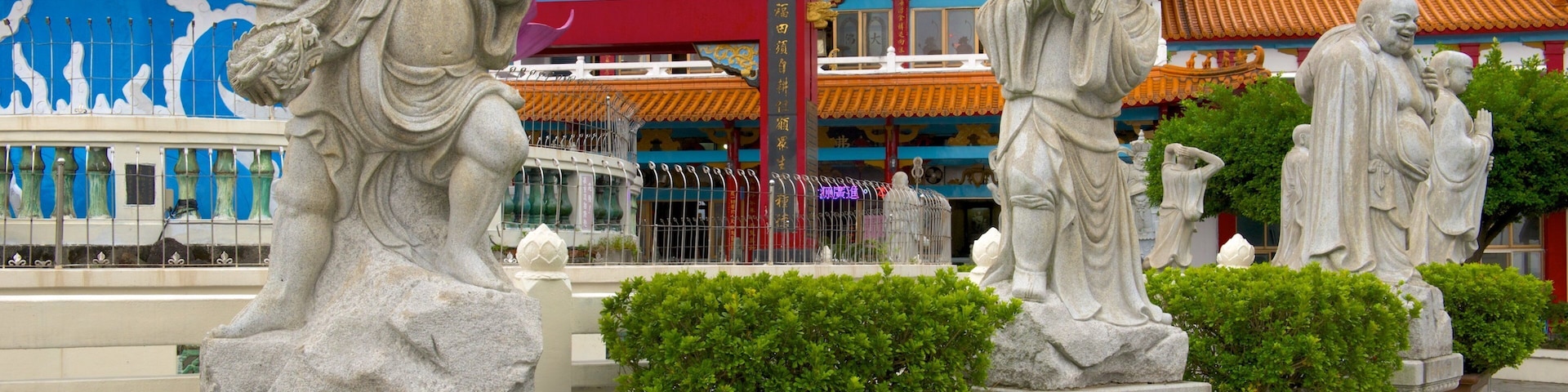 Statue of Guanyin which includes religious aspects and a statue or sculpture