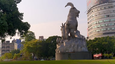 Taichung Park which includes a garden and a statue or sculpture