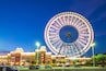 theme park with ferris wheel in taichung at dusk