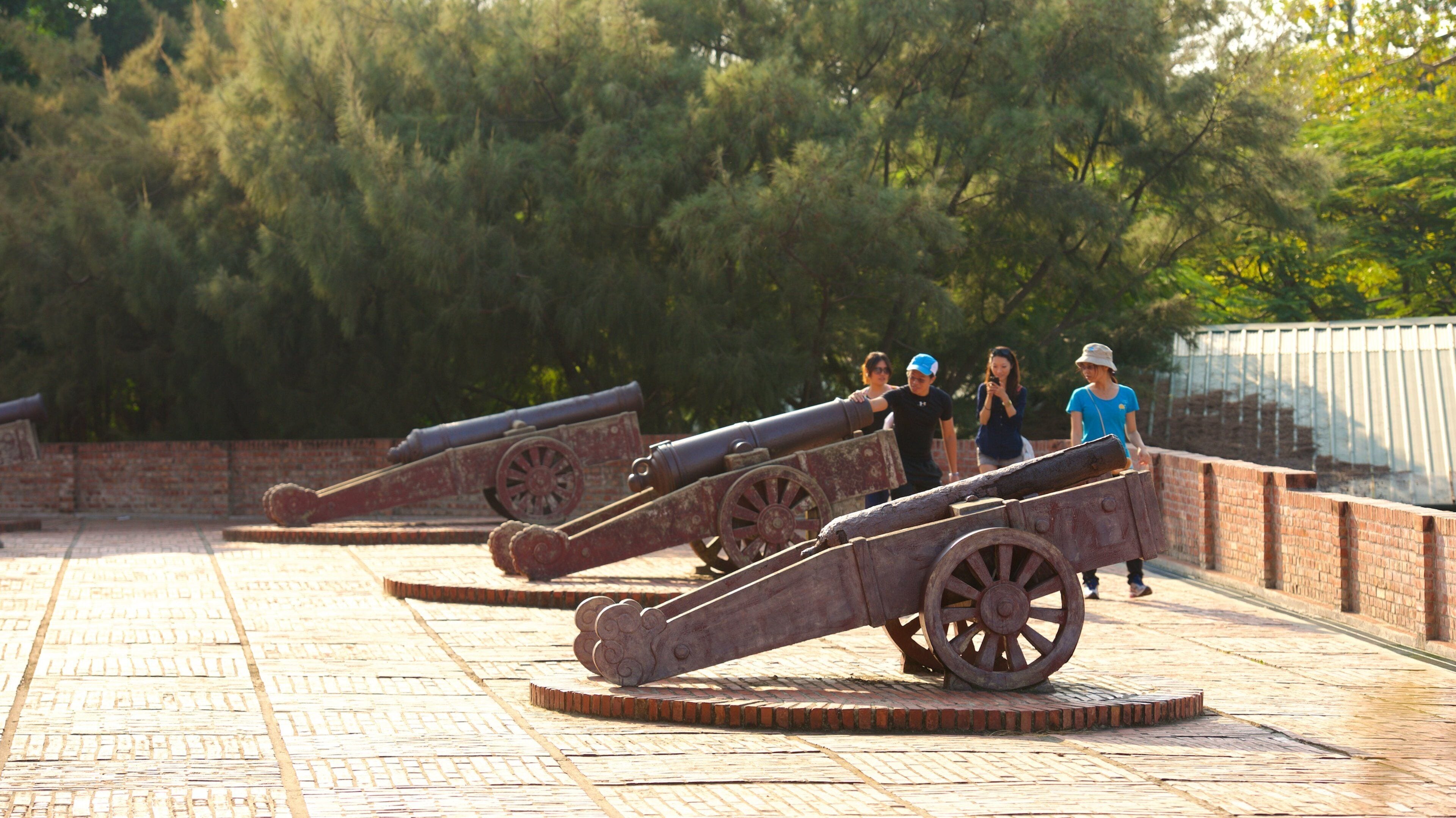 Anping Old Fort showing heritage elements and military items as well as a small group of people