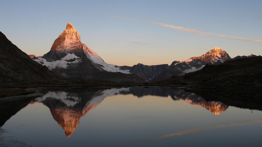 Matterhorn which includes a lake or waterhole, mountains and snow