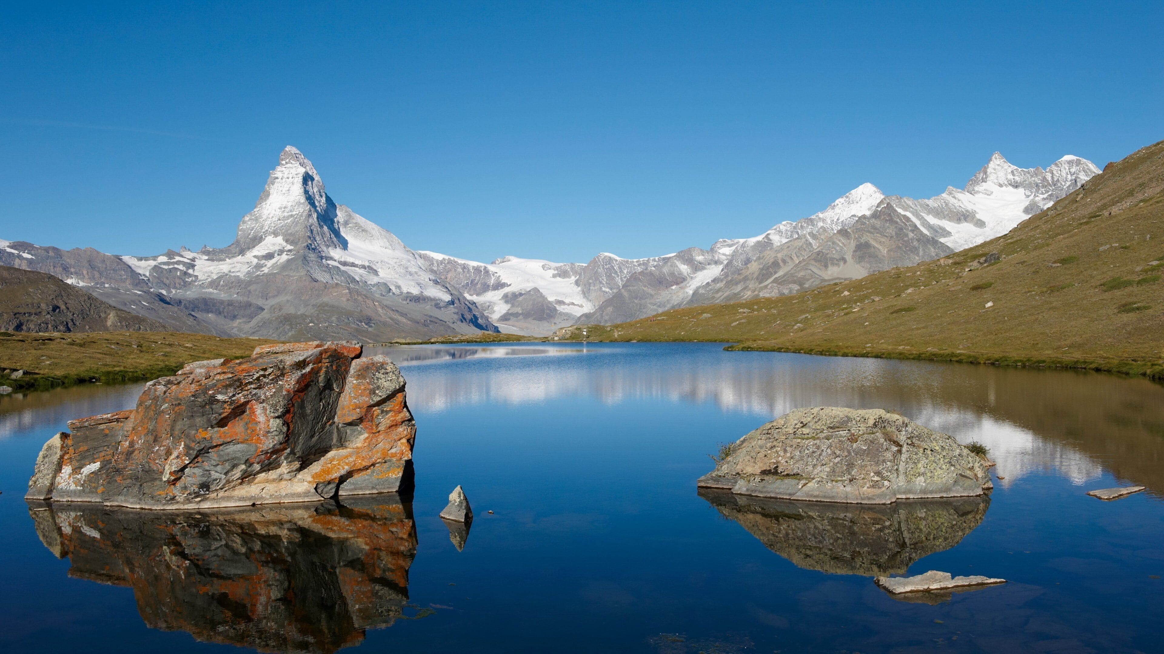 Matterhorn which includes mountains, snow and a lake or waterhole