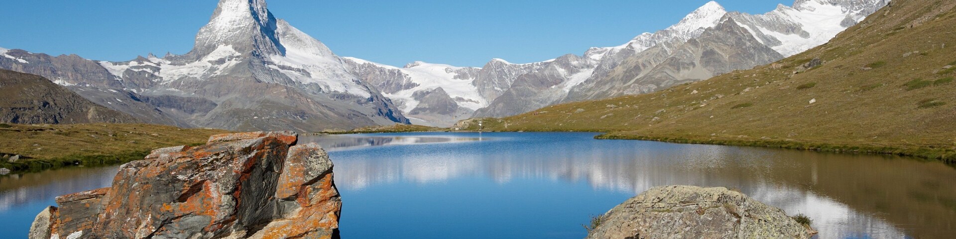 Matterhorn which includes mountains, snow and a lake or waterhole