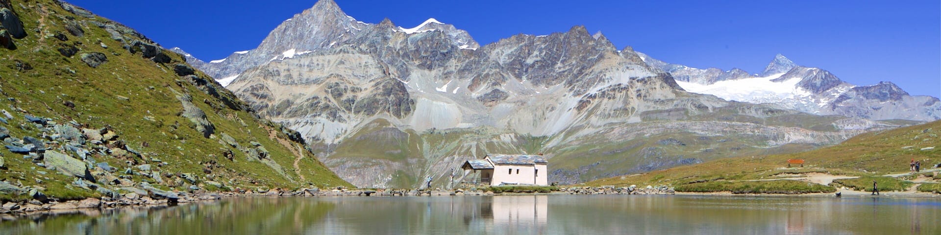Schwarzsee Lake showing a lake or waterhole and mountains