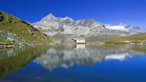 Schwarzsee Lake showing a lake or waterhole and mountains
