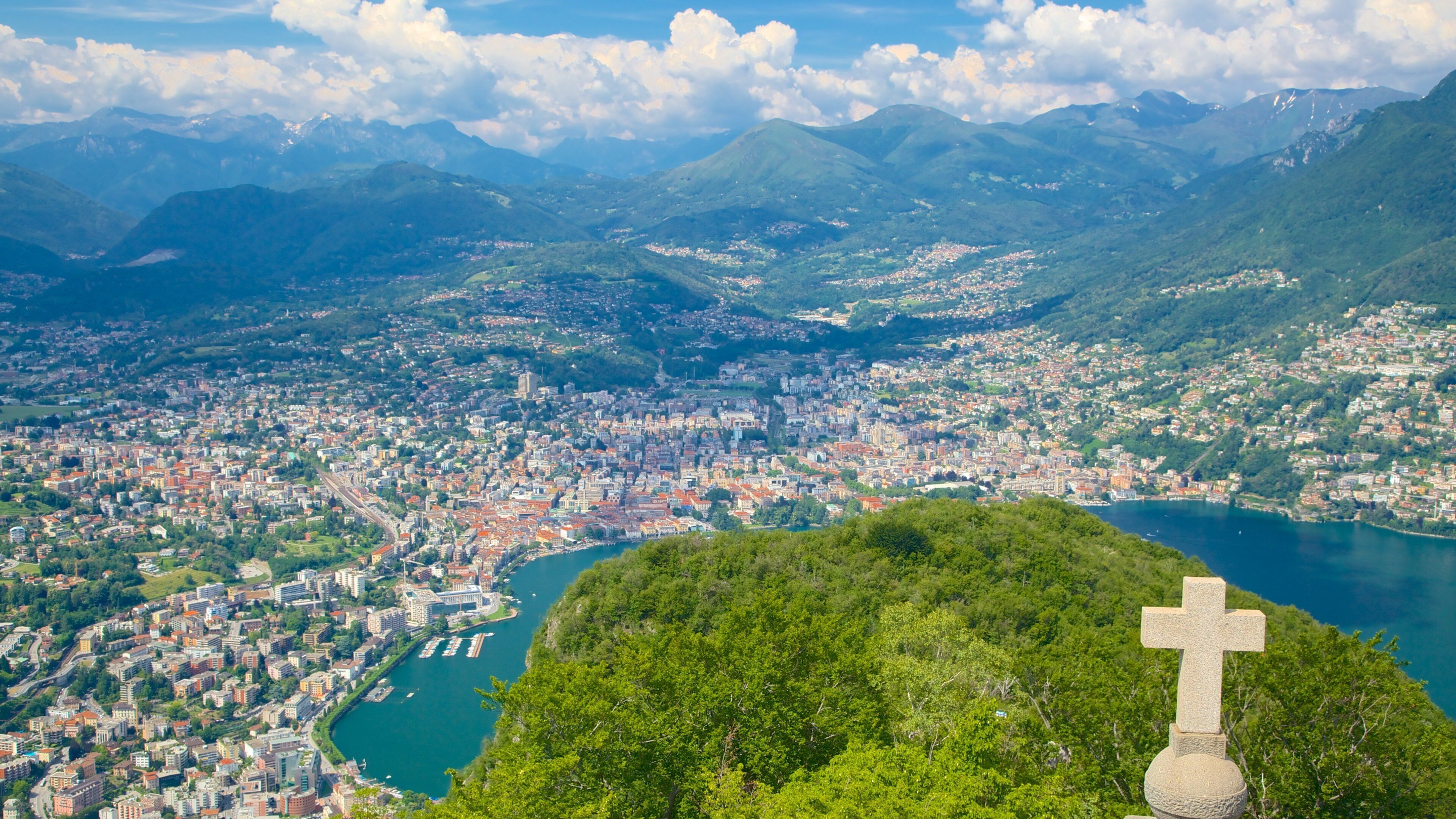 Monte San Salvatore showing religious elements, tranquil scenes and a city