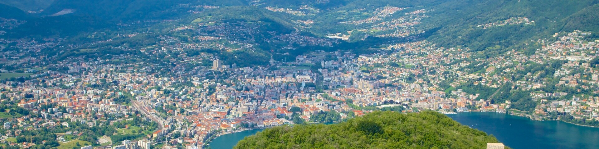 Monte San Salvatore showing religious elements, tranquil scenes and a city