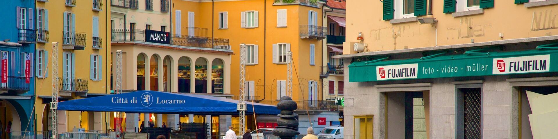 Piazza Grande showing road cycling as well as an individual femail