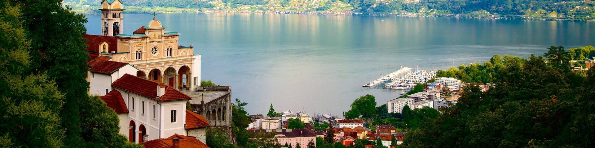 Madonna del Sasso which includes a lake or waterhole and a small town or village