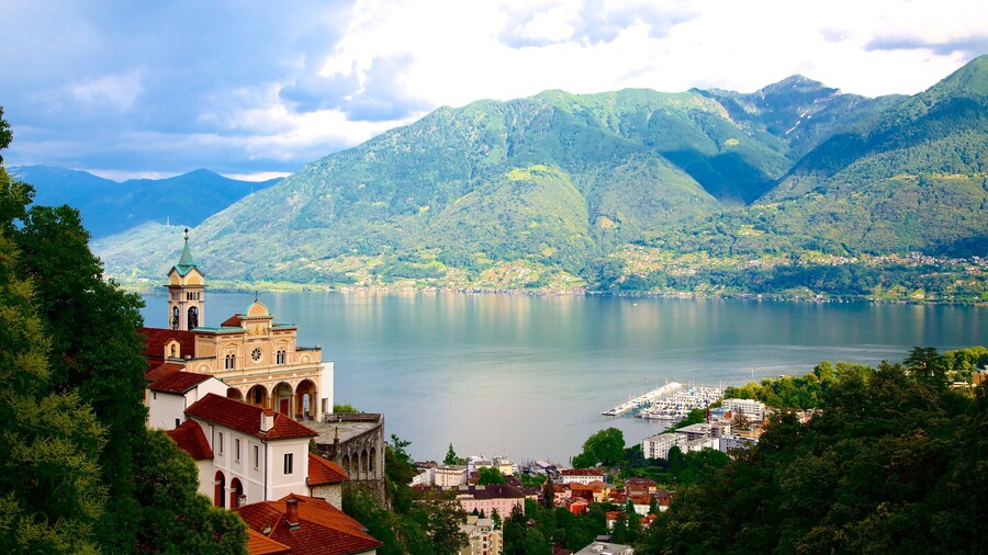 Madonna del Sasso which includes a lake or waterhole and a small town or village