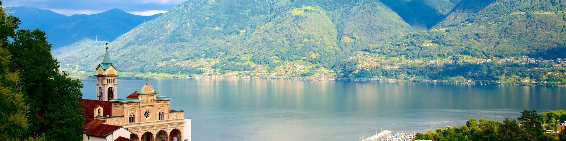 Madonna del Sasso which includes a lake or waterhole and a small town or village