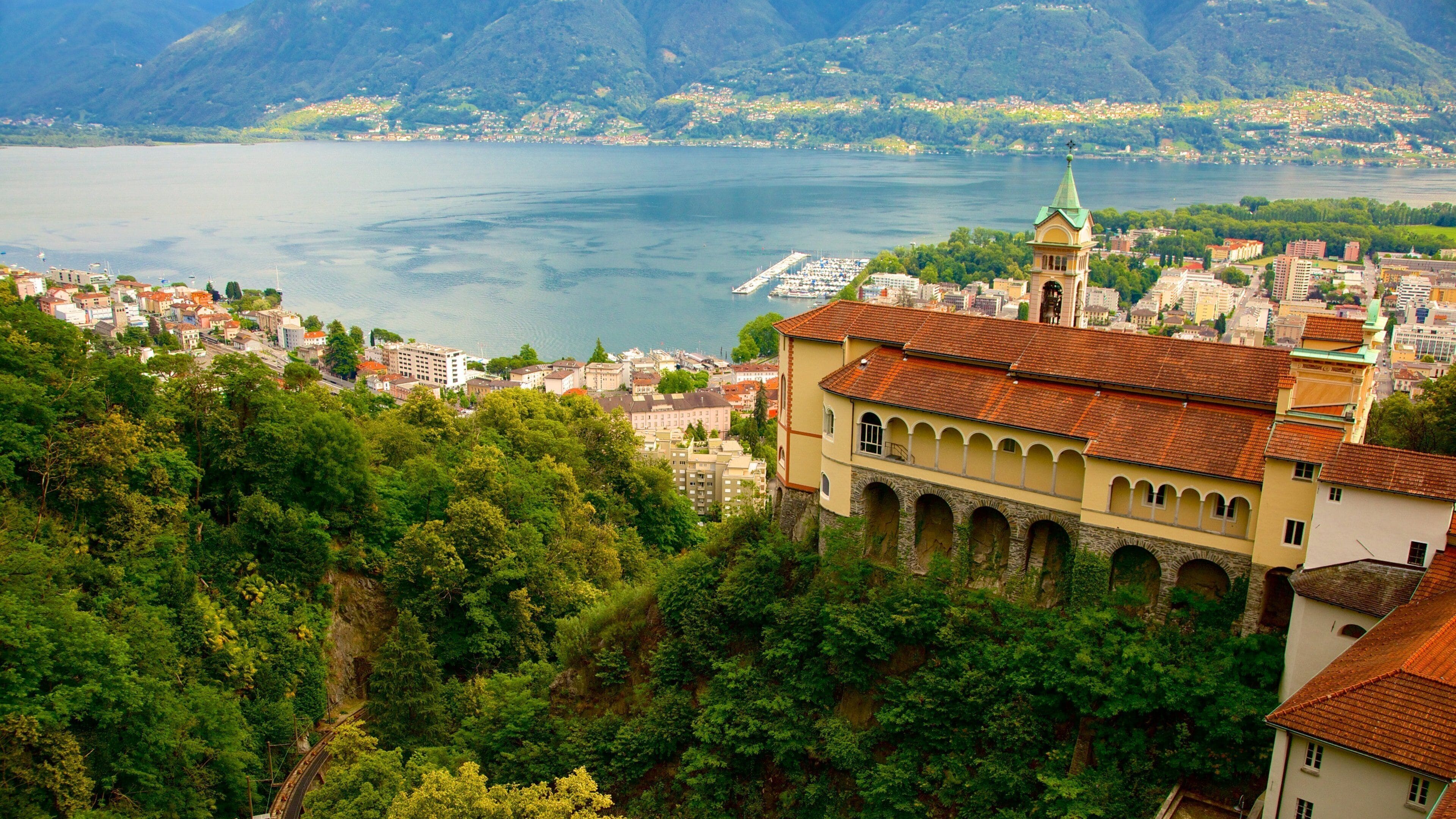 Madonna del Sasso which includes landscape views, a small town or village and a river or creek