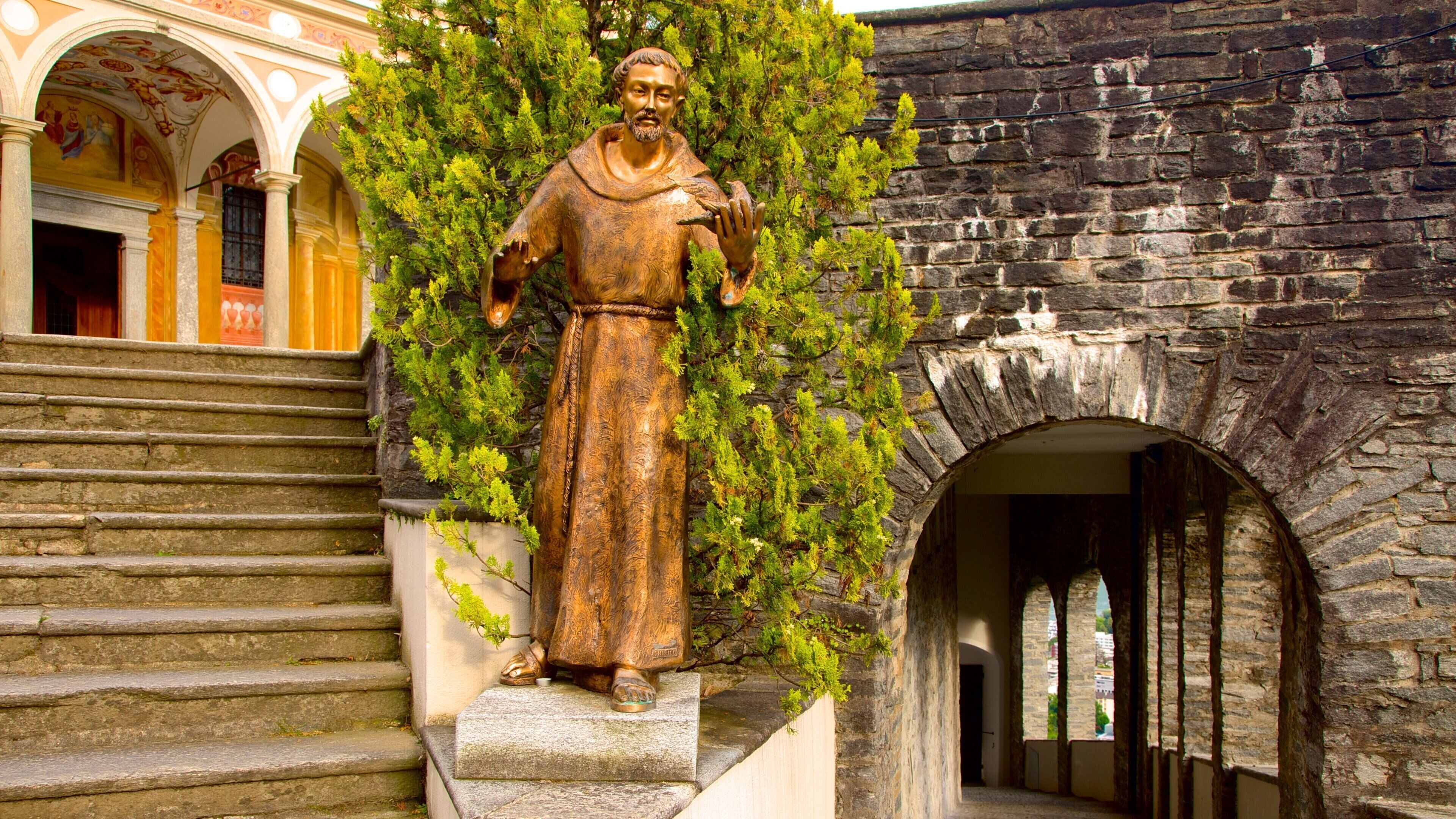 Madonna del Sasso showing a statue or sculpture and religious elements
