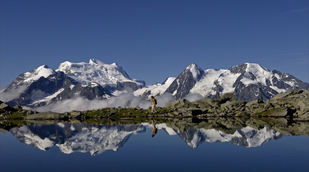Verbier Ski Resort which includes mountains, a lake or waterhole and landscape views