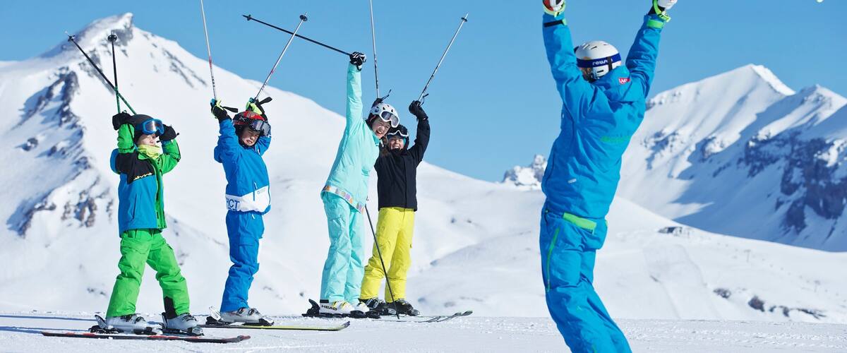 Laax Ski Resort featuring snow skiing and snow as well as a small group of people