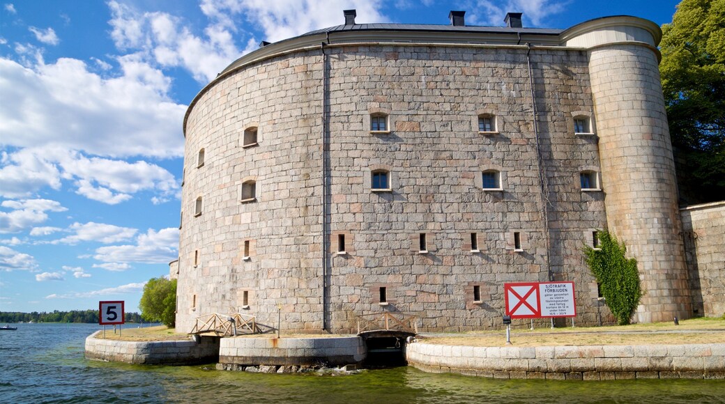 Vaxholm Fortress which includes heritage architecture and a river or creek