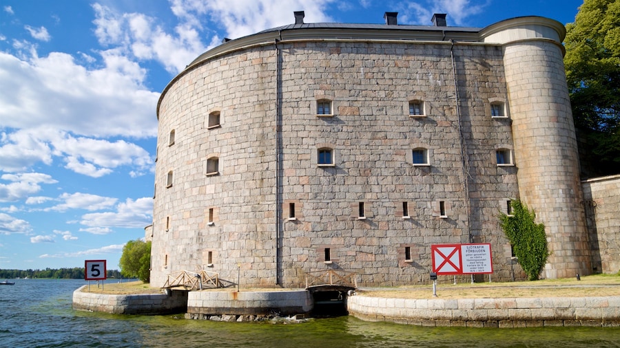 Vaxholm Fortress which includes heritage architecture and a river or creek