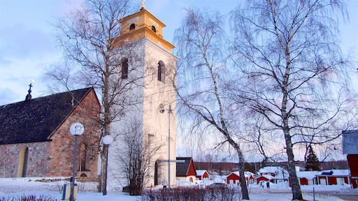 Gammelstad kyrka som inkluderer solnedgang, kulturarv og snø
