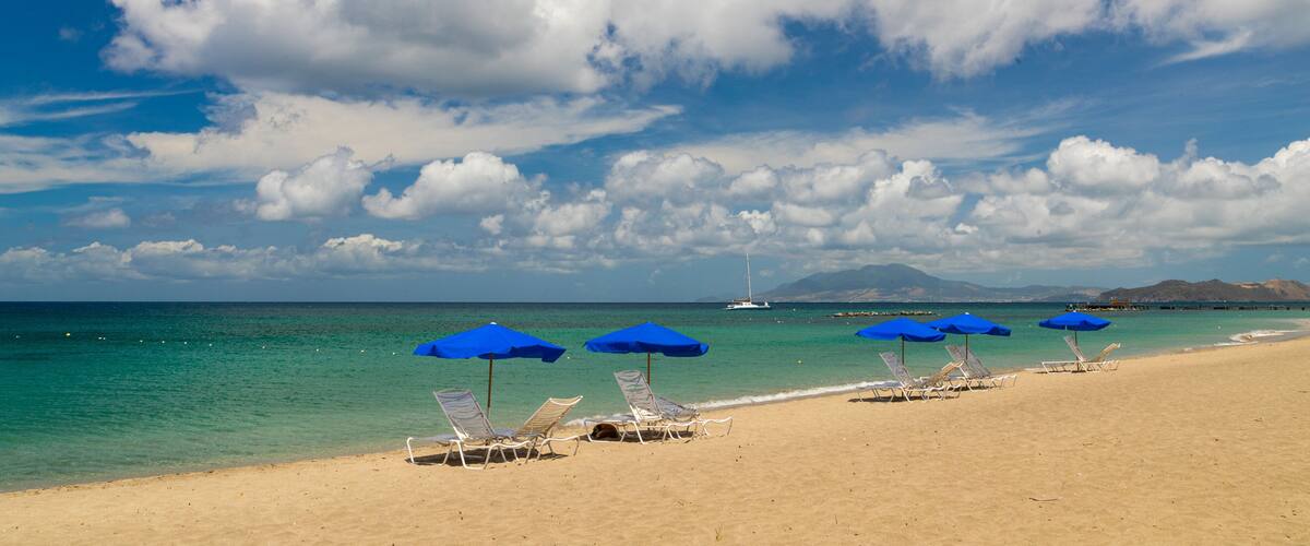 Pinney\'s Beach which includes general coastal views and a sandy beach