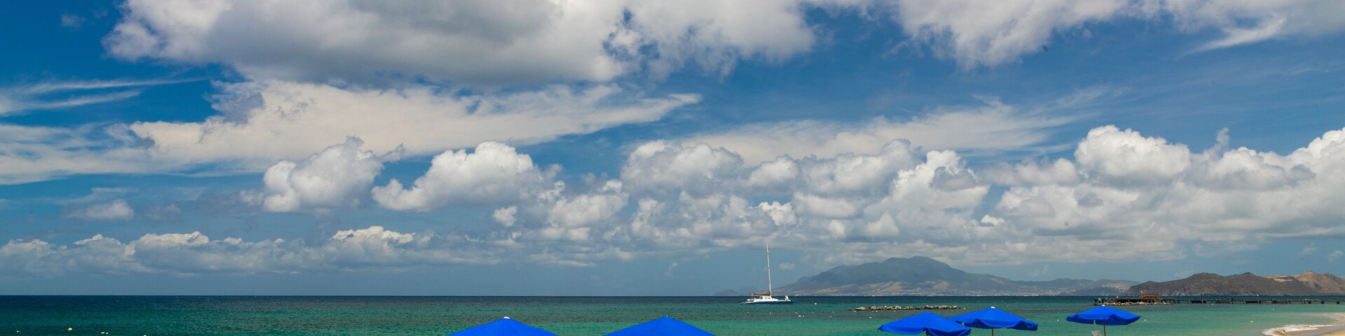 Pinney\'s Beach which includes general coastal views and a sandy beach