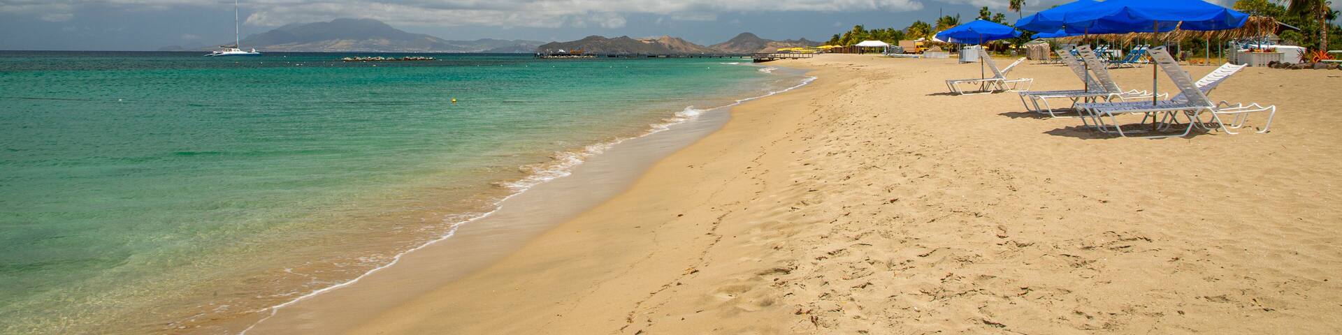 Pinney\'s Beach featuring a sandy beach and general coastal views