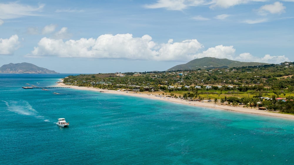 Pinney\'s Beach featuring boating, general coastal views and a coastal town