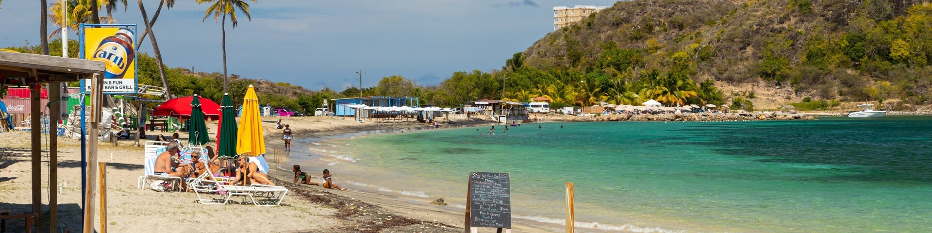 Cockleshell Bay which includes general coastal views and a sandy beach