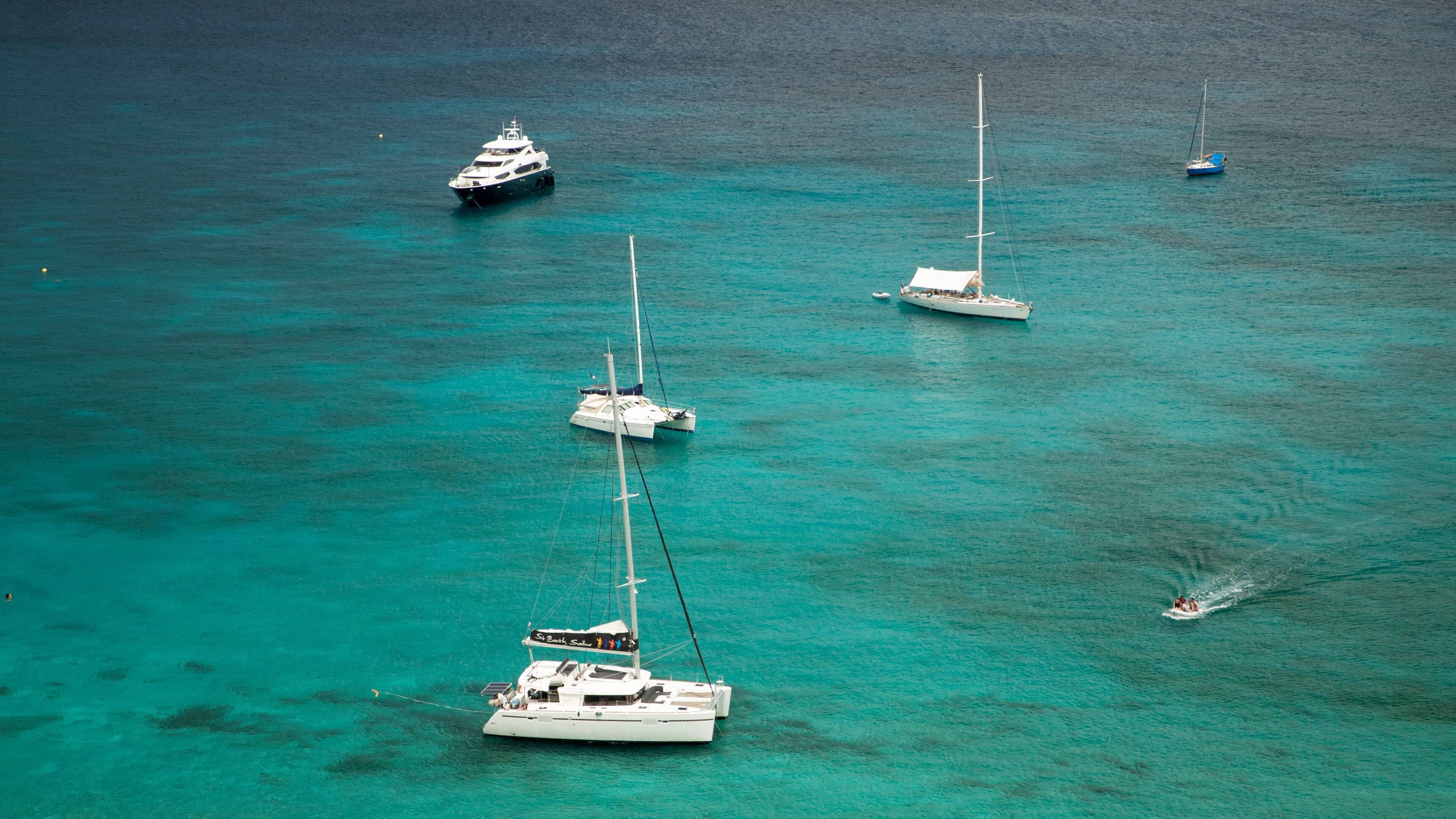 Colombier Beach featuring tropical scenes, general coastal views and a bay or harbor