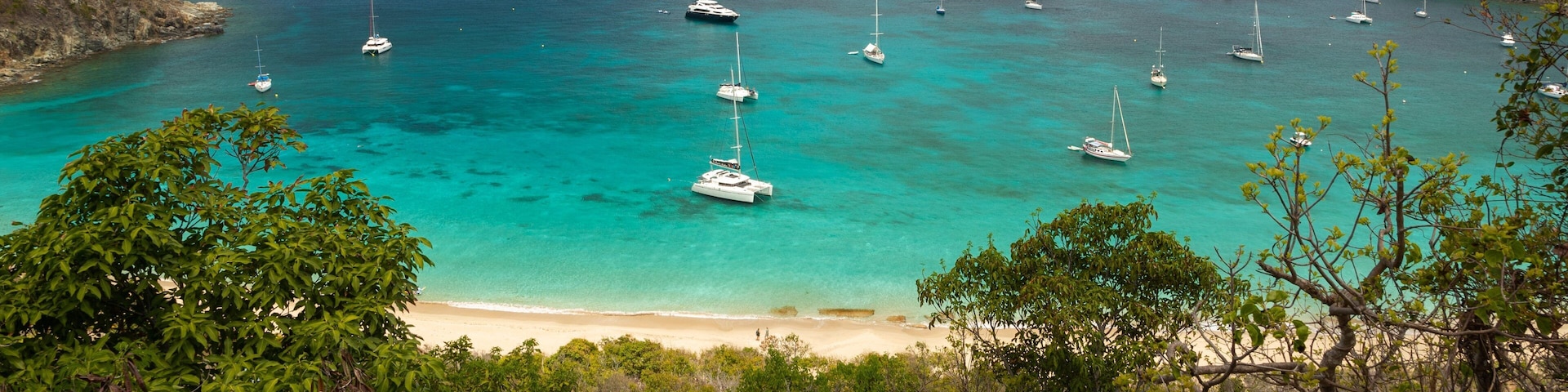 Colombier Beach which includes landscape views, a bay or harbor and general coastal views