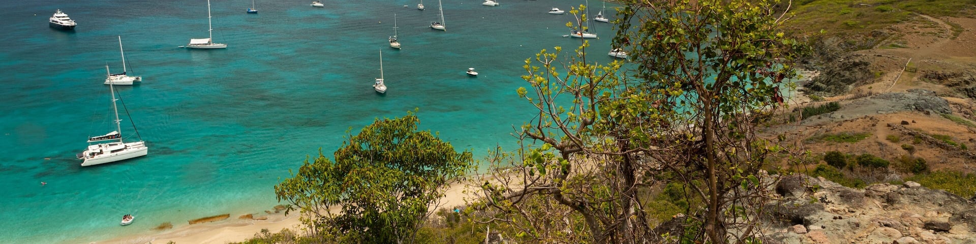 Colombier Beach which includes a bay or harbor, general coastal views and landscape views