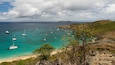 Colombier Beach which includes a bay or harbor, general coastal views and landscape views